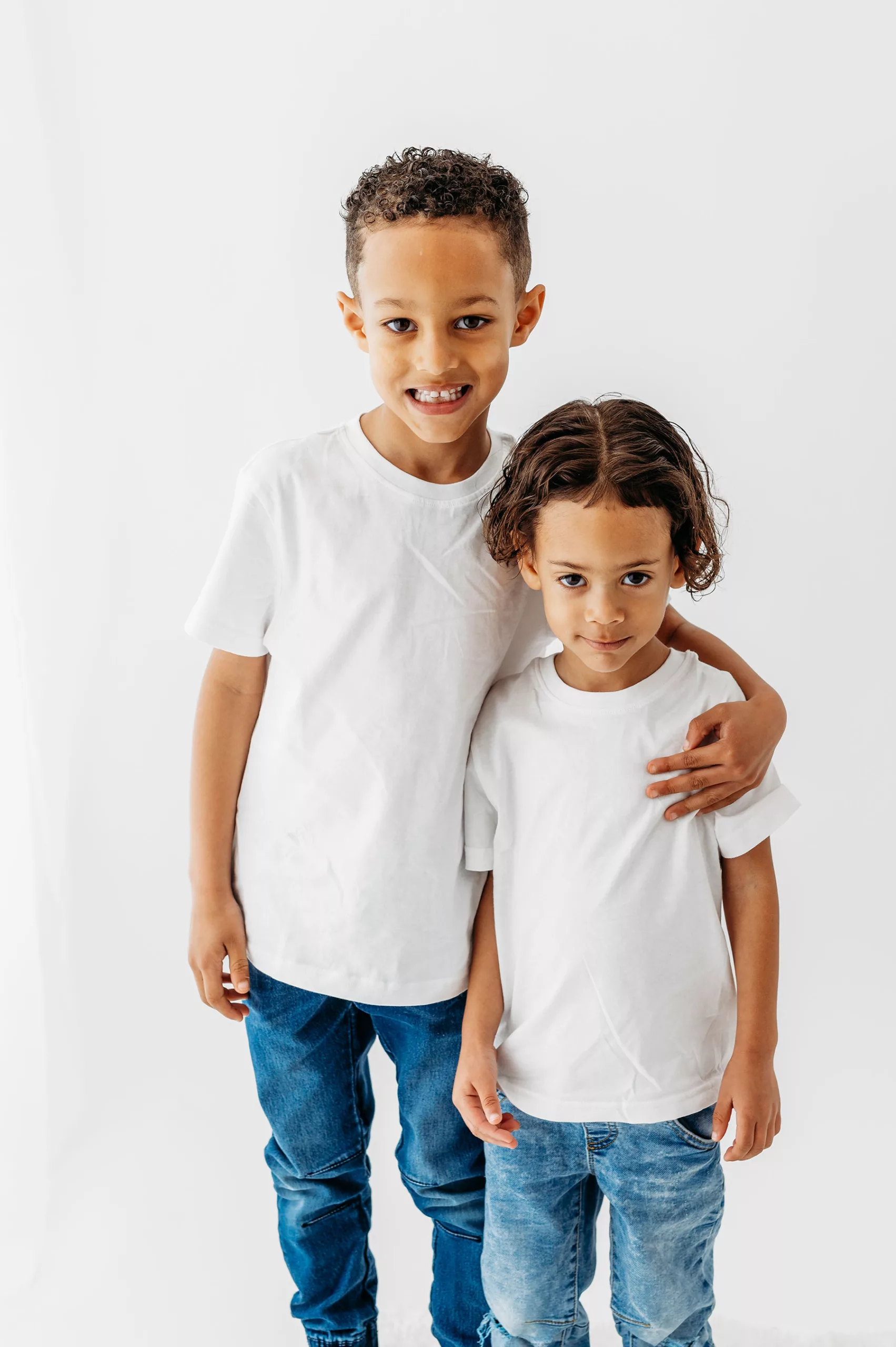 Family photoshoot- two brothers wearing white t-shirt and blue jeans